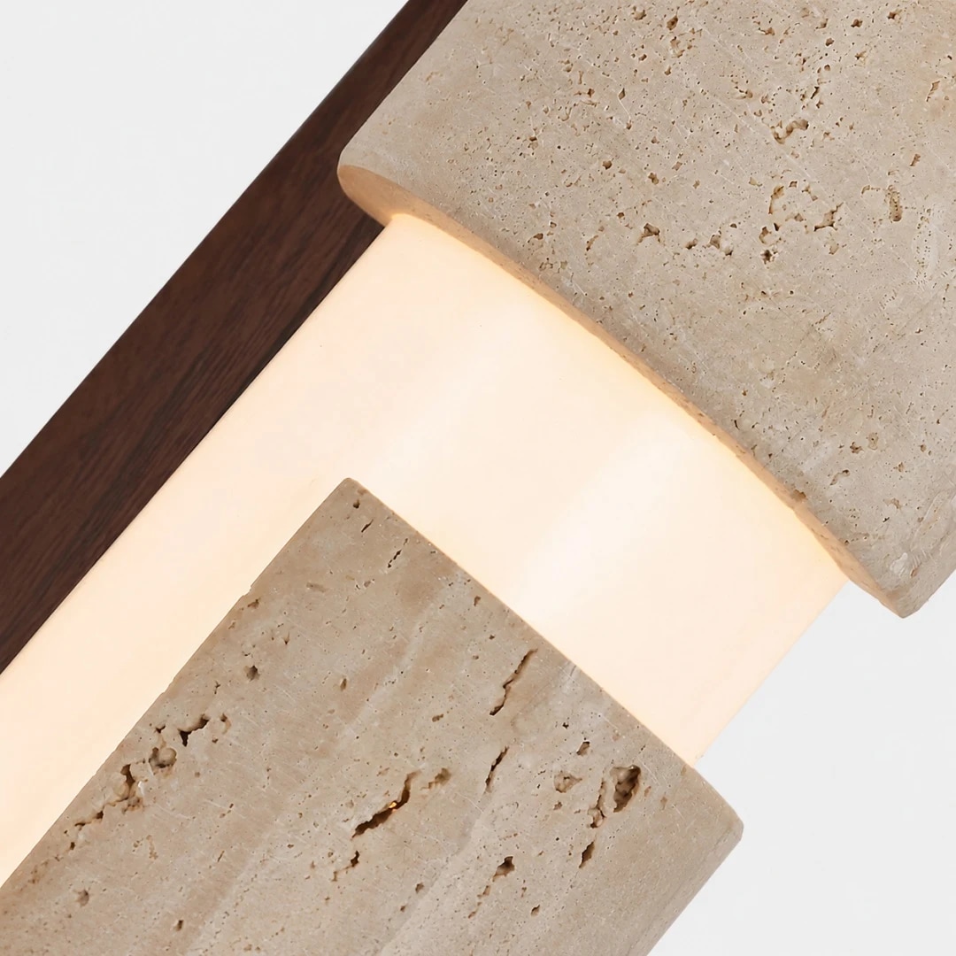 Walnut wood mounting detail with glowing acrylic diffuser and travertine shade