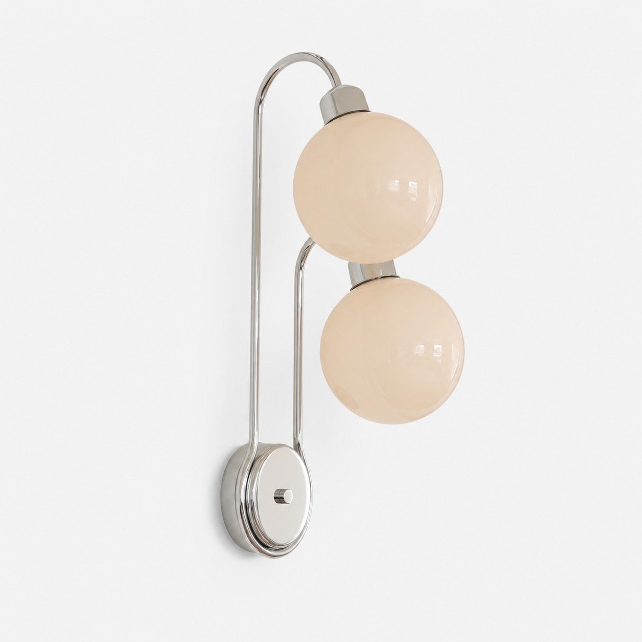 Close view of polished metal arm and milk coffee glass shade